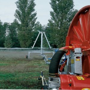 Hose reel irrigation system with boom sprinkler